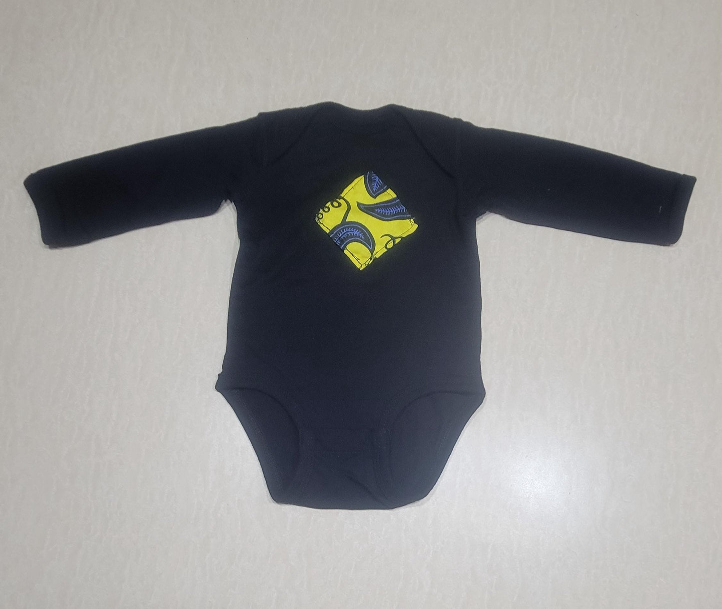Onesie with blue & yellow African print applique (size: 6 months)